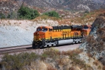 BNSF 7912 and BNSF 5190 poke their noses from aound the curve as they continiue south/west with a loaded Vehicle Train towards San Bernardino, CA.